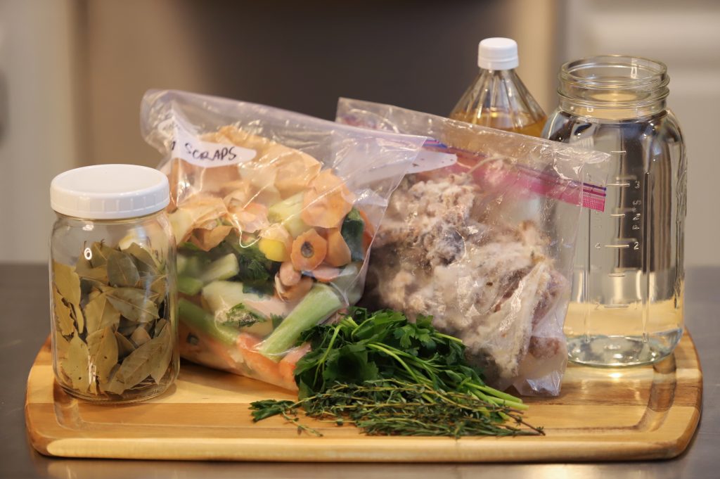 Boone broth ingredients. Bones, Vegetable Scraps, Herbs, and apple cider vinegar