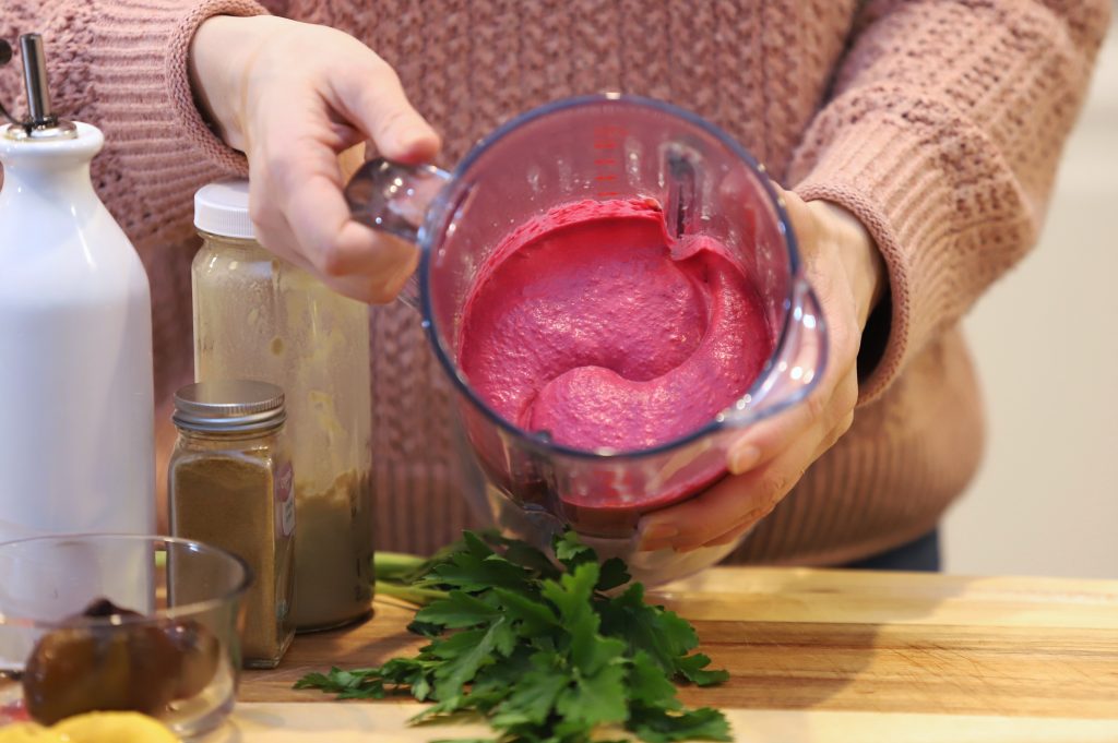 Roasted beet hummus vibrant pink in blender