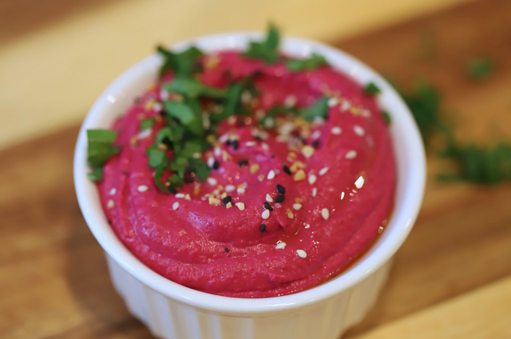 ramekin full of beet hummus