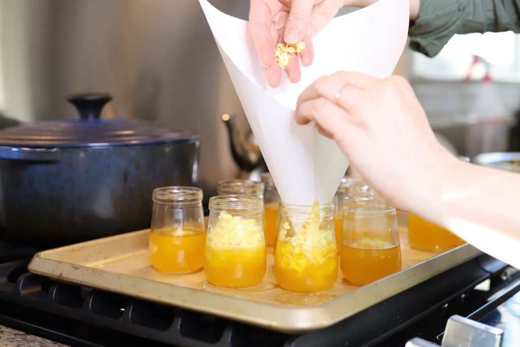 adding more wax to candles