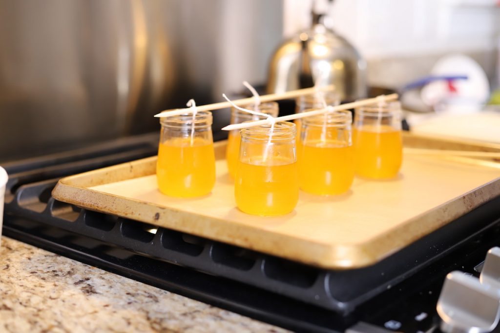 meatled wax in jars with wicks 