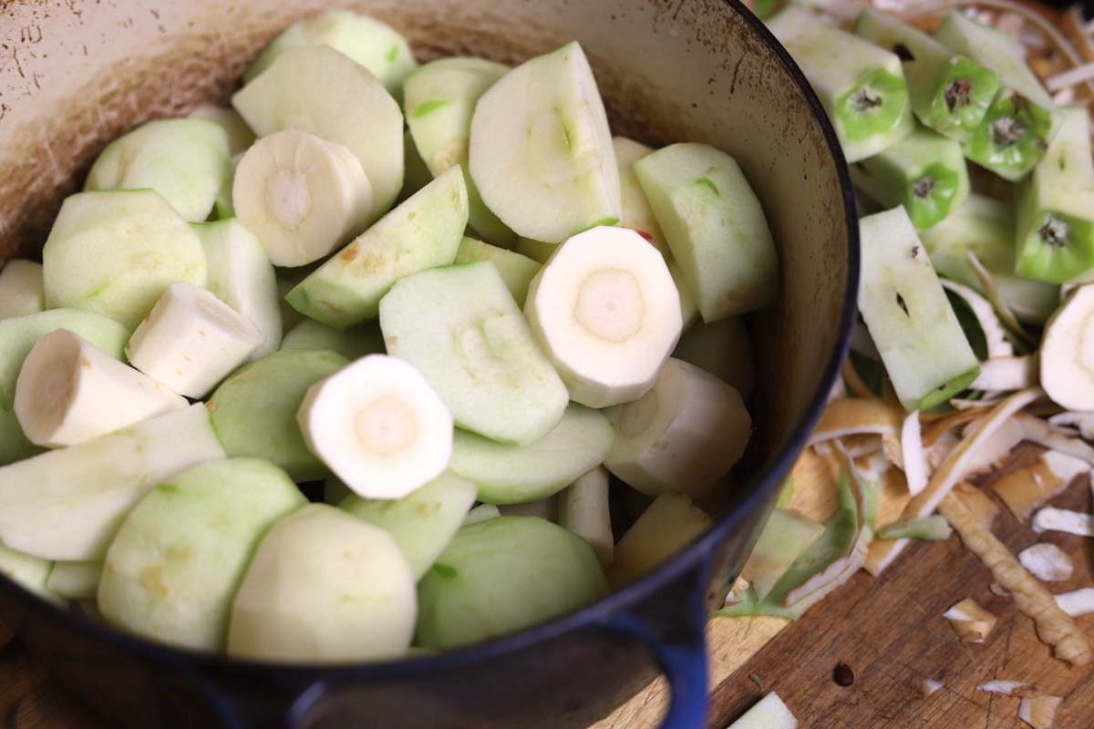 aples and parsnips peeled in a pot